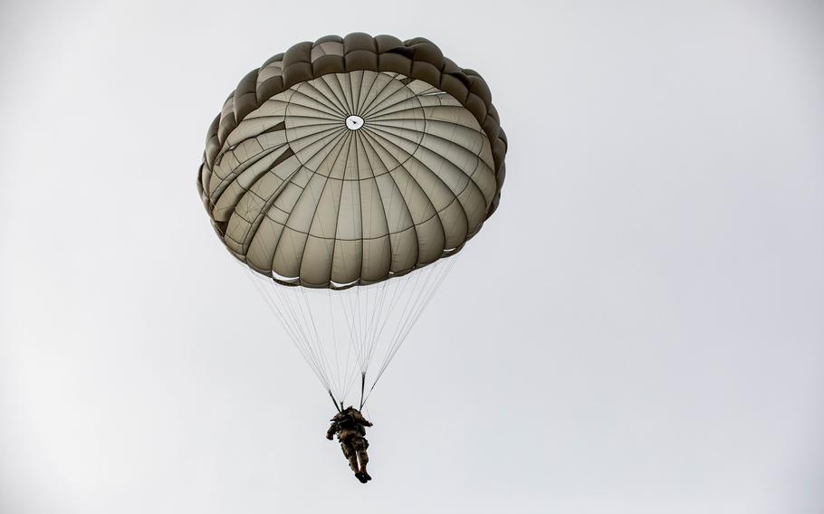 A U.S. Special Operations Command soldier parachutes in during an exercise in Renningen, Germany, on Feb. 16, 2022. A joint parachute rigging site that was allocated $23 million in the military’s 2024 budget is part of a transformation of the Army’s installation in Baumholder, Germany, into a special operations hub.