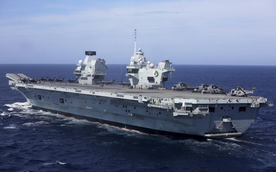 Military personnel participate in a NATO training exercise on board the aircraft carrier HMS Queen Elizabeth off the coast of Portugal on May 27, 2021.