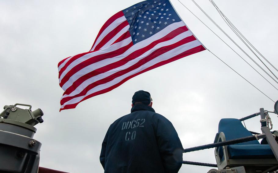 Cmdr. Chris Gahl stands aboard the USS Barry as the guided-missile destroyer passes through the Taiwan Strait late last year. 