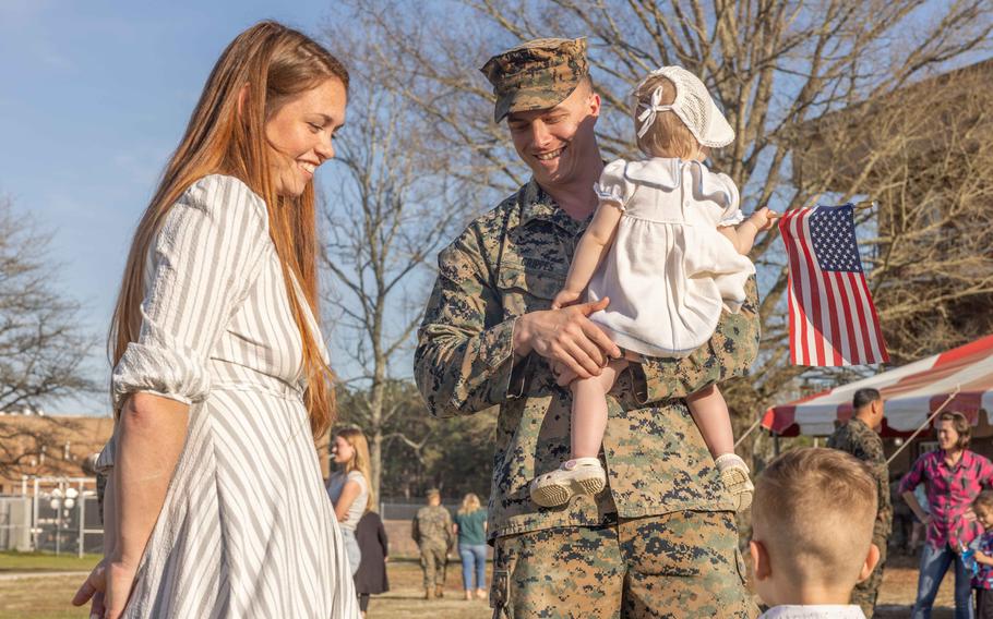 U.S. Marine Corps Capt. Jacob Crippes, a logistics officer with Combat Logistics Battalion 22, 26th Marine Expeditionary Unit (Special Operations Capable) reunites with his family at Camp Lejeune, N.C., Monday, March 18, 2024.