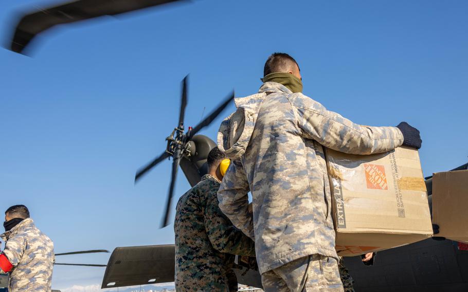 A U.S. Army UH-60M Black Hawk assigned to 1st Armored Division, Combat Aviation Brigade, is loaded with relief supplies at Incirlik Air Base, Turkey, Feb. 21, 2023. 