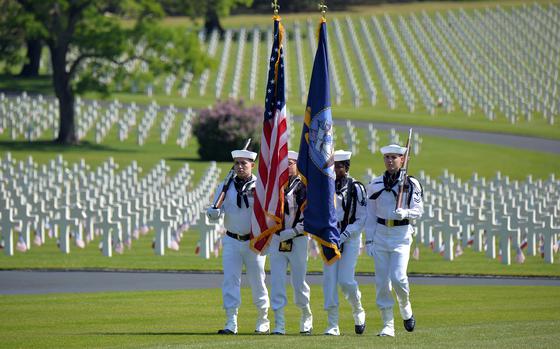 A U.S. Navy color guard present the colors at the Memorial Day ceremony at Lorraine American Cemetery in St. Avold, France, in 2023. Behind the sailors are some of the cemeterys 10,481 graves. 