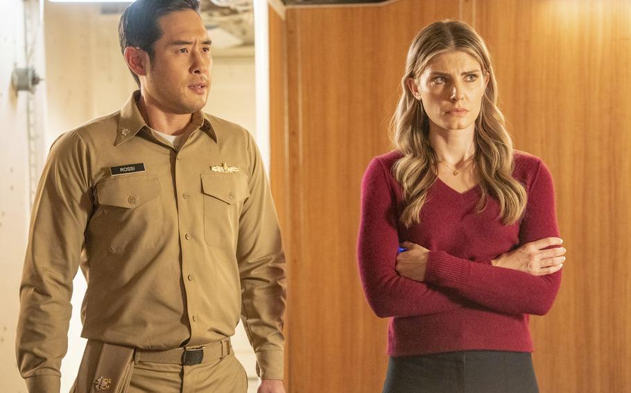This image released by NBC shows Raymond Lee, left, and Caitlin Bassett in a scene from “Quantum Leap.” Bassett spent seven years in the U.S. Army.