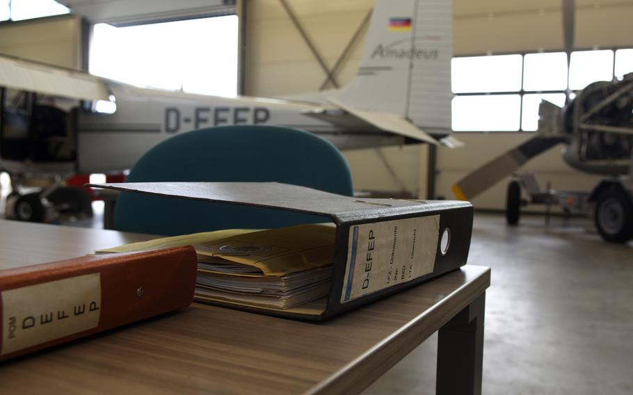 Training manuals sit on a desk inside the new Airframe and Powerplant training and testing facility at Ramstein Air Base, Germany, Nov. 15, 2022. The Federal Aviation Administration certified the center on Wednesday, the first such training program of its kind overseas and on a U.S. military base. The program enables military maintainers to get a professional license they can use to work on planes in the civilian world.