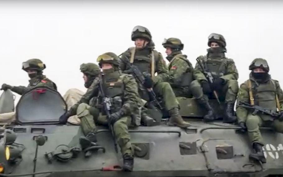 In this handout photo released by Russian Defense Ministry Press Service, Belarusian peacekeepers ride an armored personnel carrier as they leave a Russian military plane at an airfield in Kazakhstan, Saturday, Jan. 8, 2022. As Kazakhstan struggles to cope with an increasingly violent uprising this week, it has turned for help to a Russian-led security bloc, the Collective Security Treaty Organization. Thousands of Russian troops have now been dispatched to Kazakhstan to help secure strategic facilities.