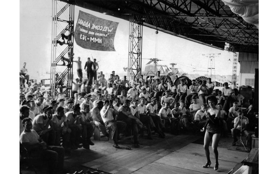 American USO trooper Bunita Jeane dances for members