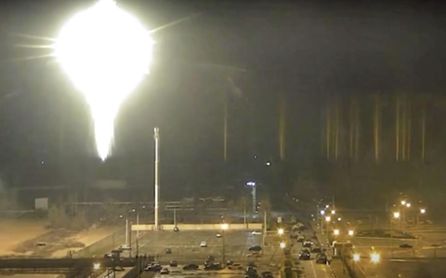 This image made from a video released by Zaporizhzhia nuclear power plant shows bright flaring object landing in grounds of the nuclear plant in Enerhodar, Ukraine, on Friday, March 4, 2022. Russian forces shelled Europe’s largest nuclear plant early Friday, sparking a fire as they pressed their attack on a crucial energy-producing Ukrainian city and gained ground in their bid to cut off the country from the sea.