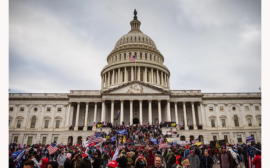 Protesters stand on the East steps of the Capitol Building on Jan. 6, 2021, in Washington, DC.