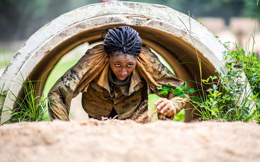 Pvt. Gorgeous Wilson completes an obstacle conditioning course at Fort Benning, Ga., in August 2021. 