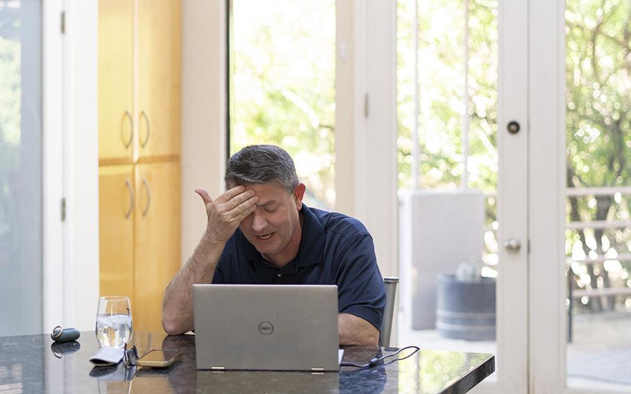 Bill Gates, a Republican elected to the Maricopa County Board of Supervisors, speaks to his therapist during a virtual session in his home in Phoenix.