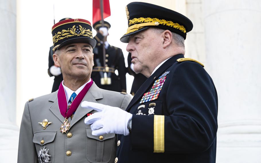 Chairman of the Joint Chiefs of Staff Gen. Mark Milley speaks with France Chief of Defense Staff Gen. Thierry Burkhard outside of the Memorial Amphitheater at Arlington National Cemetery, Arlington, Va., Sept. 21, 2023.
