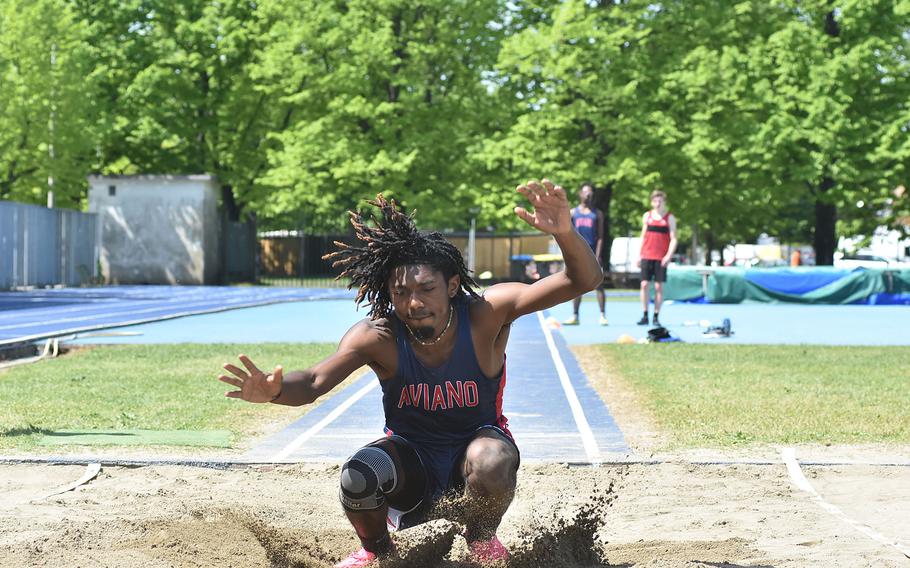 Aviano's Joness LaSalle sends some dirt flying while winning the boys long jump Saturday, April 29, 2023, at a DODEA-Europe track meet in Pordenone, Italy.