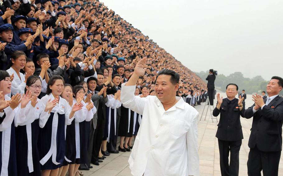 North Korean leader Kim Jong Un waves in this image released in August 2021 by the Korean Central News Agency. 