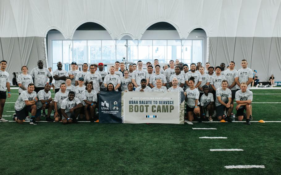 Active military members join the Carolina Panthers for practice and a few drills as part of the USAA Salute to Service Boot Camp on Aug. 14, 2023 in Charlotte, N.C..