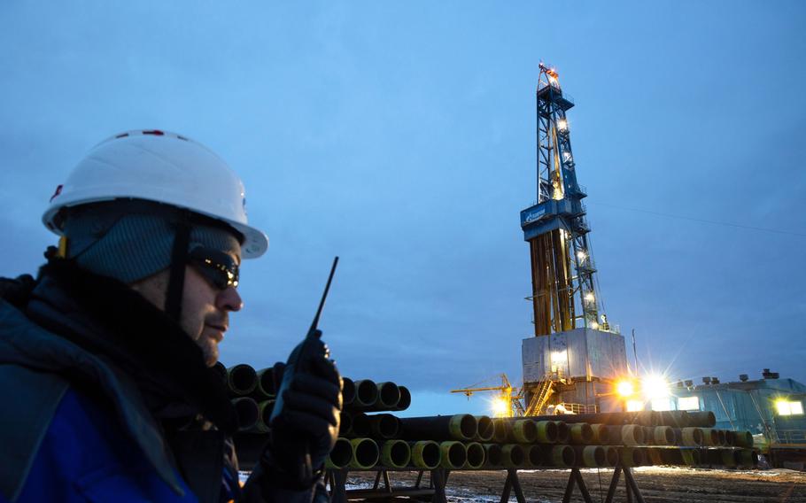 Lights illuminate a gas drilling rig on the Gazprom Chayandinskoye oil, gas and condensate field, a resource base for the Power of Siberia gas pipeline, in the Lensk district of the Sakha Republic, Russia, on Oct. 13, 2021. MUST CREDIT: Bloomberg photo by Andrey Rudakov.