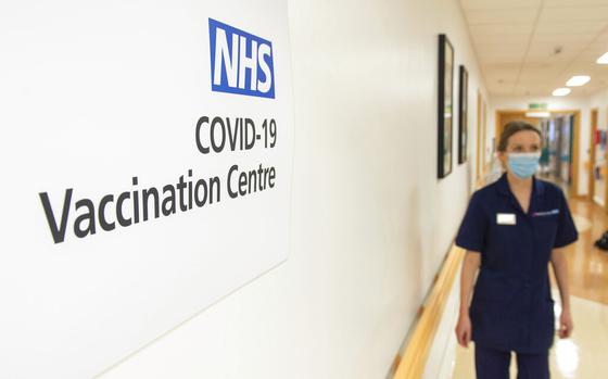 Signs for the COVID-19 Vaccination Centre at the Royal Free Hospital in London, Monday Dec. 7, 2020, as preparations are made ahead of the coronavirus vaccination programme from Tuesday. (Dominic Lipinski/Pool via AP)
