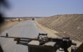 Israeli army vehicles transport a group of soldiers and journalists along the Morag corridor in southern Gaza on June 8, 2025. The Israeli military invited reporters for a tour in the European Hospital in Khan Younis. (AP Photo/Ohad Zwigenberg)