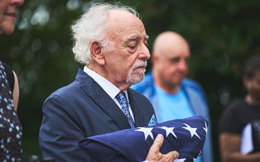 A veteran receives a folded flag