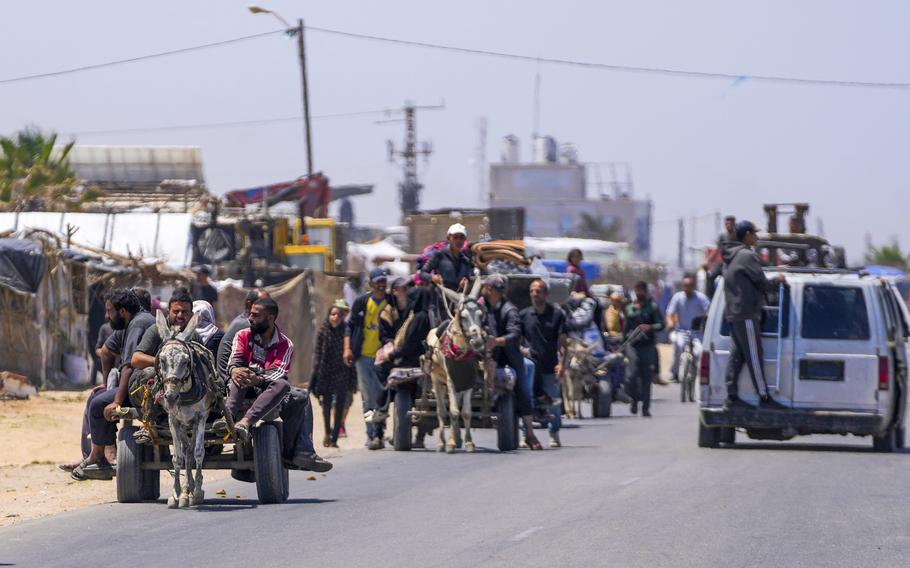 Displaced Palestinians arrive in central Gaza after fleeing from the southern Gaza city of Rafah in Deir al Balah, Gaza Strip, on Thursday, May 9, 2024. The Israeli army has ordered tens of thousands of people to evacuate Rafah as it conducts a ground operation there.