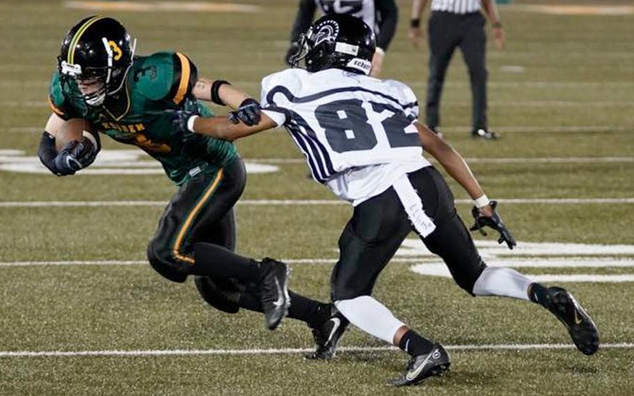 Robert D. Edgren's Daichi Goodson tries to outrun Zama's Ayden Helton.