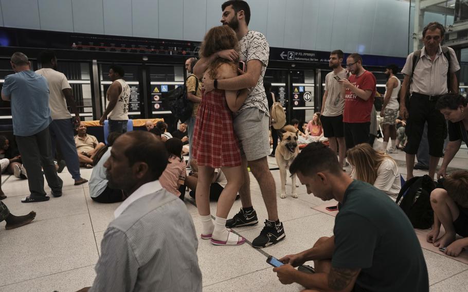 People shelter in an underground metro station as air raid sirens warn of incoming strikes by Iran, in Ramat Gan, near Tel Aviv, Israel, Wednesday, June 18, 2025. 