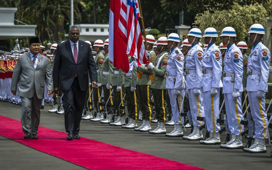 Secretary of Defense Lloyd Austin is welcomed to Jakarta, Indonesia, by Indonesia Defense Minister Prabowo Subianto on Monday, Nov. 21, 2022. 