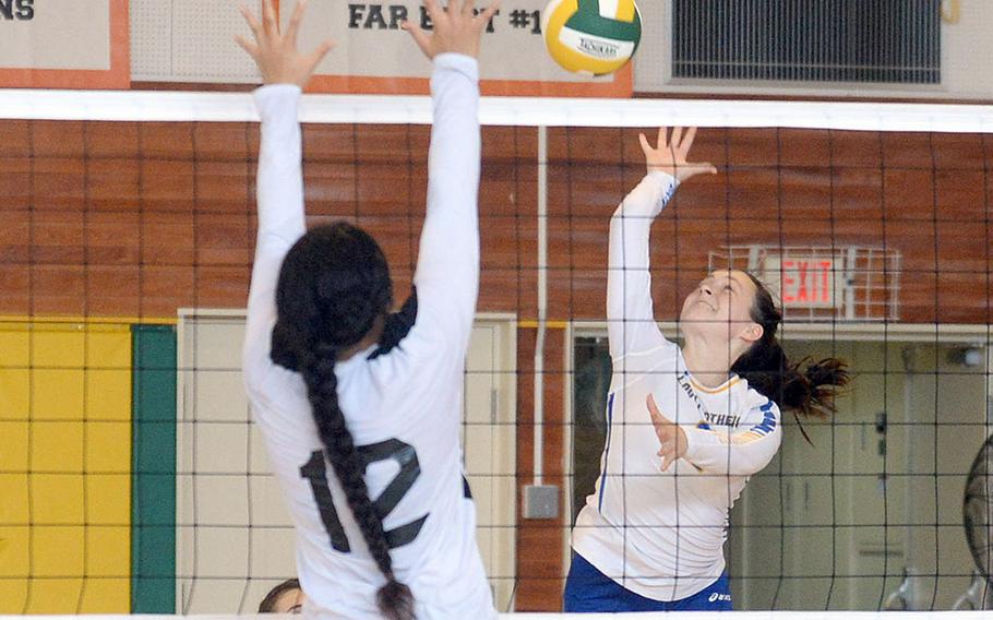 Yokota's Malia Hutchins readies a spike against Zama's Kierstyn Aumua during Saturday's Japan girls volleyball match. The Panthers won in four sets.