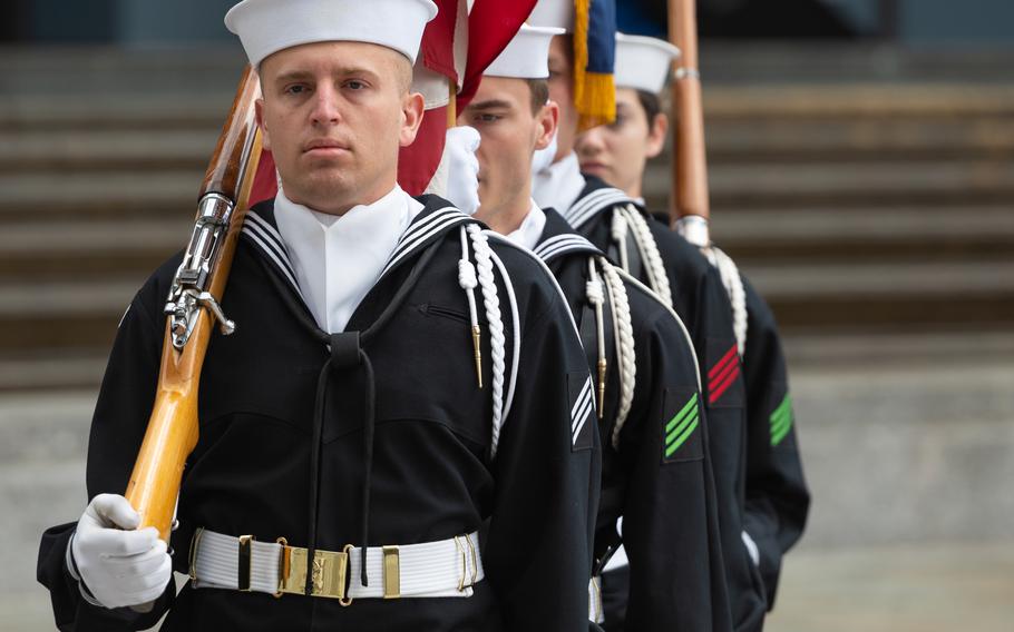 Members of the U.S. Navy Ceremonial Guard prepare to parade the colors at the Blessing of the Fleet ceremony at Navy Memorial in Washington, April 9, 2022 
