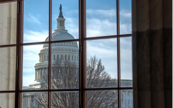 The U.S. Capitol building is seen through a window in the Senate Russell office building in Washington, D.C., on Thursday, Feb. 8, 2024.