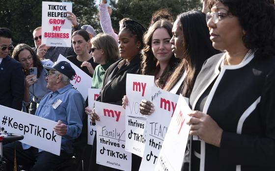 Supporters of TikTok hold signs during a rally to defend the app, Wednesday, March 22, 2023, at the Capitol in Washington. The House holds a hearing Thursday, with TikTok CEO Shou Zi Chew about the platform's consumer privacy and data security practices and impact on kids. (AP Photo/Jose Luis Magana)