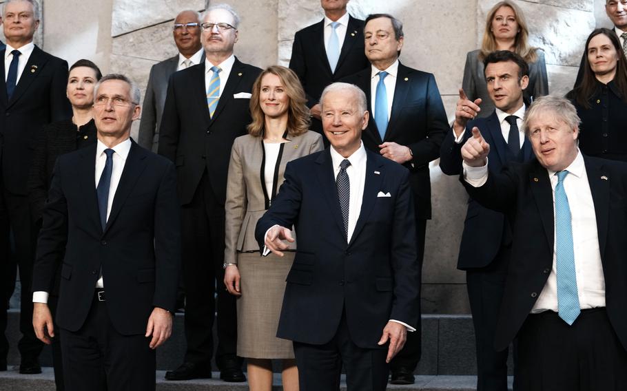 NATO Secretary General Jens Stoltenberg, center front left, U.S. President Joe Biden, center front, and British Prime Minister Boris Johnson, front right, pose during a group photo during an extraordinary NATO summit at NATO headquarters in Brussels, Thursday, March 24, 2022. As the war in Ukraine grinds into a second month, President Joe Biden and Western allies are gathering to chart a path to ramp up pressure on Russian President Vladimir Putin while tending to the economic and security fallout that’s spreading across Europe and the world. 