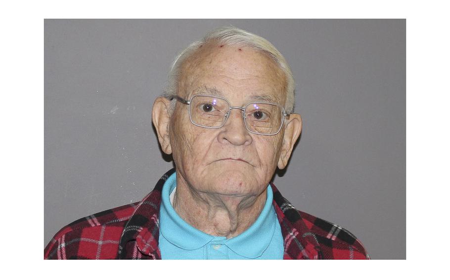 A police booking photo shows Malcolm N. Goodwin, a retired pathologist who served in the military for decades and has been charged with six counts of predatory criminal sexual assault involving minors.