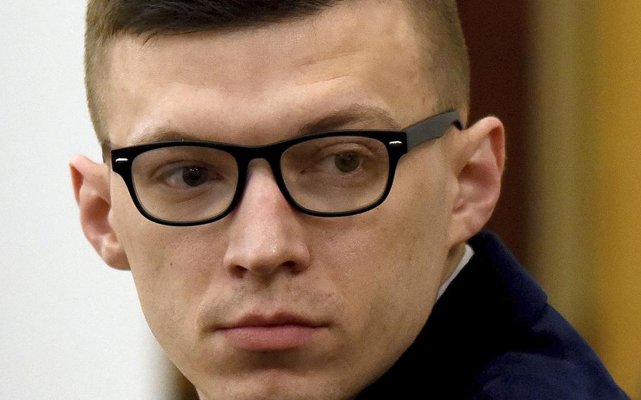 Volodymyr Zhukovskyy looks back at the gallery before closing statements started at his trial at Coos County Superior Court in Lancaster, N.H., Aug. 9, 2022. 
