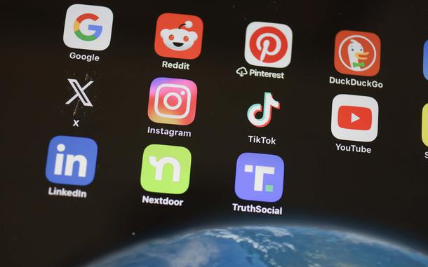 A close-up of apps on a screen: Google, Reddit, Pinterest, DuckDuckGo, X, Instagram, TikTok, YouTube, LinkedIn, Nextdoor, TruthSocial.