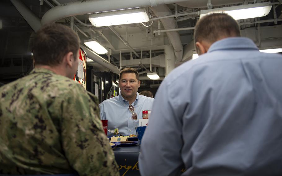 Rep. Guy Reschenthaler, R-Pa., eats with sailors in 2019 aboard the aircraft carrier USS Dwight D. Eisenhower.