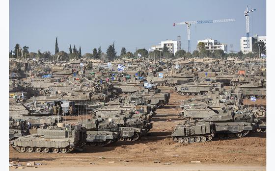 Israeli army battle tanks are positioned in southern Israel near the border with the Gaza Strip on May 9, 2024, amid the ongoing conflict in the Palestinian territory between Israel and the Hamas movement. (Ahmad Gharabli/AFP via Getty Images/TNS)