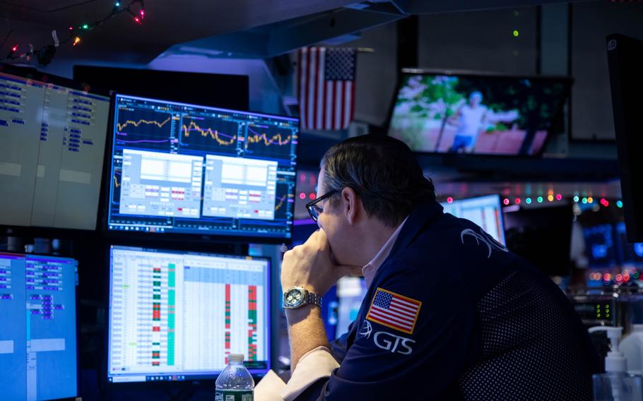 A trader works on the floor of the New York Stock Exchange in New York on Dec. 13, 2021. 