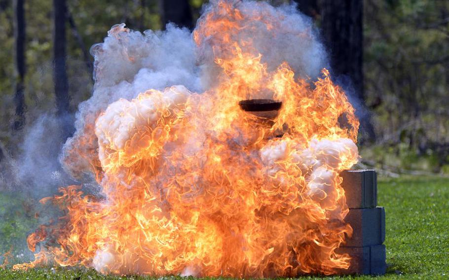 Explosive material burns during Joint FBI and Westover Post Blast Investigation Training held at Westover Air Reserve Base in Chicopee, Mass., May 9, 2022.