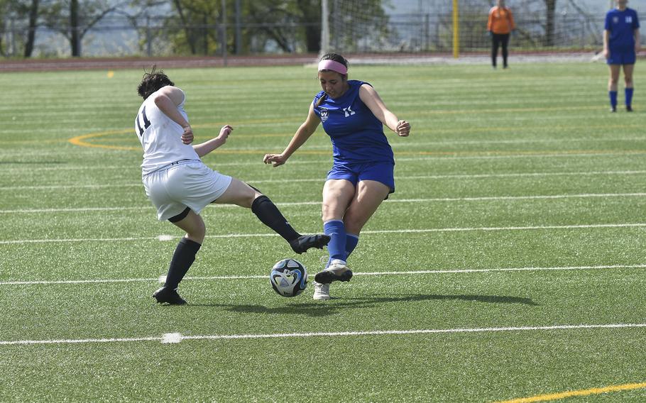 Wiesbaden senior Esperanza Munoz attempts a pass against Lakenheath's Hailey Buchanan in Wiesbaden, Germany on April 6, 2024. Munoz scored Wiesbaden's only goal in the tie against Lakenheath.