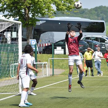 Lakenheath goalkeeper Alex Murillo grabs a corner during pool-play action on May 15, 2023, in Reichenbach-Steegen, Germany.