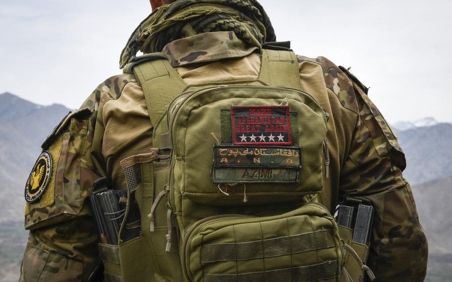 Maj. Sohrab Azimi, a decorated and American-educated Afghan commando, looks over a valley in northeastern province of Kapisa in Afghanistan, after an operation against militants March 6, 2021. Azimi would be killed alongside 20 of his comrades in an operation in Faryab on June 16. 