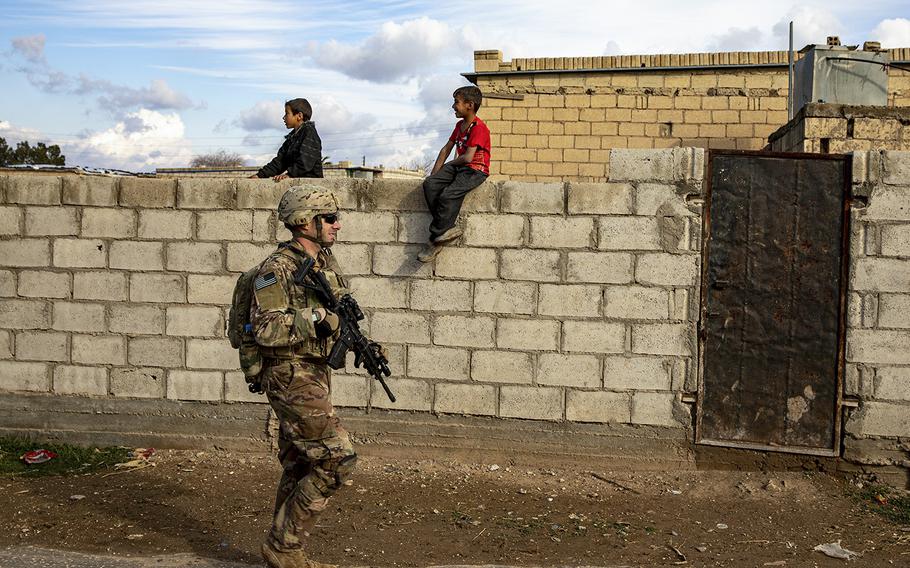 U.S. Army Sgt. Kyle Luthman, assigned to Bravo Company, 1st Battalion, 118th Infantry Regiment, 37th Infantry Brigade Combat Team, Combined Joint Task Force – Operation Inherent Resolve, walks through a village during a dismounted patrol, Syria, Feb. 3, 2023. 