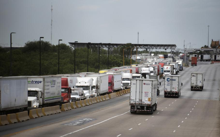 Trucks travel across the World Trade International Bridge in Laredo, Texas.