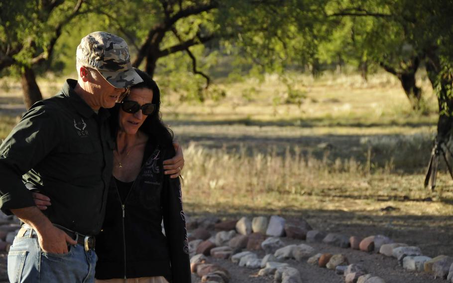 A veteran walks with a loved one on the grounds of Boulder Crest Foundation, which is dedicated to helping veterans with post-traumatic stress disorder.