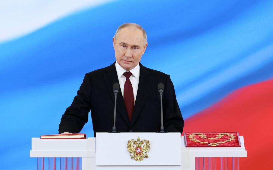 Russian President Vladimir Putin takes the oath of office during a ceremony at the Kremlin in Moscow on May 7, 2024.