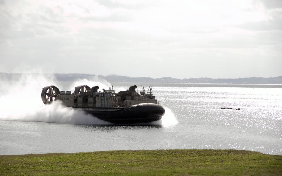 A landing craft air cushion from the USS Green Bay lands with an M142 High Mobility Artillery Rocket System, or HIMARS, at Kin Blue Beach, Okinawa, Feb. 6, 2022. The exercise was part of the Noble Fusion exercise. 