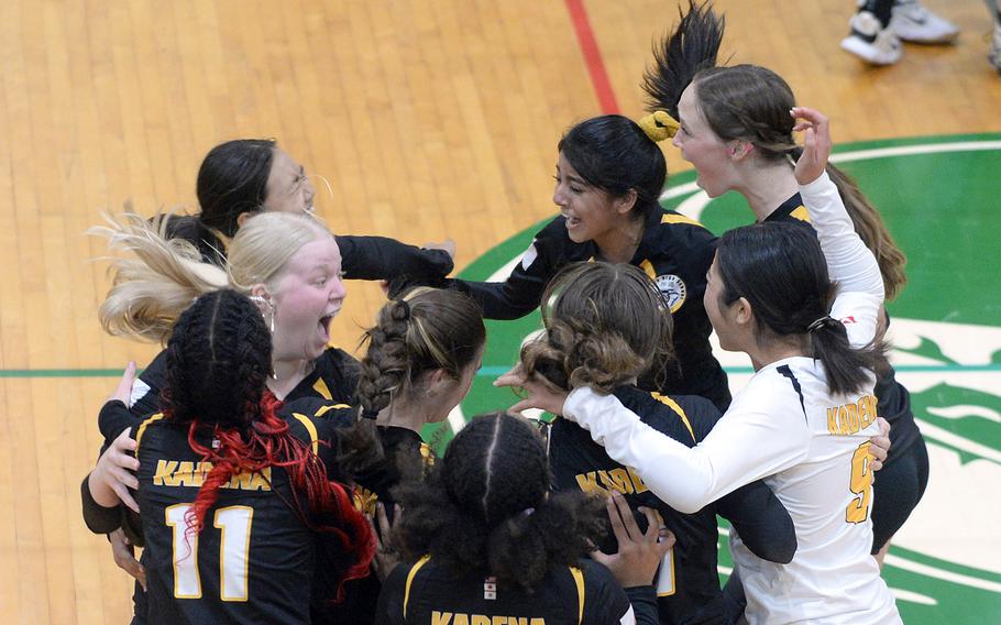 Kadena volleyball players celebrate their 27-25 second-set win over Kubasaki during Tuesday's Okinawa girls volleyball match. The Dragons won in four sets. It was the first set the Panthers have won in 16 matches since competition resumed in September 2021 following the onset of the coronavirus pandemic.