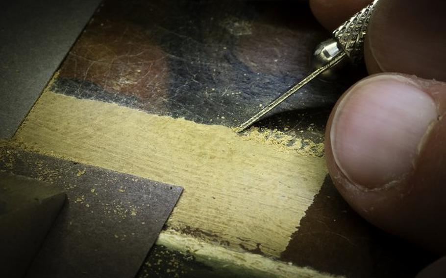 A detail of  the restoration work that went into Johannes Vermeer's "Girl Reading a Letter at an Open Window."