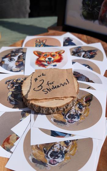 Stack of stickers with different types of dogs on them
