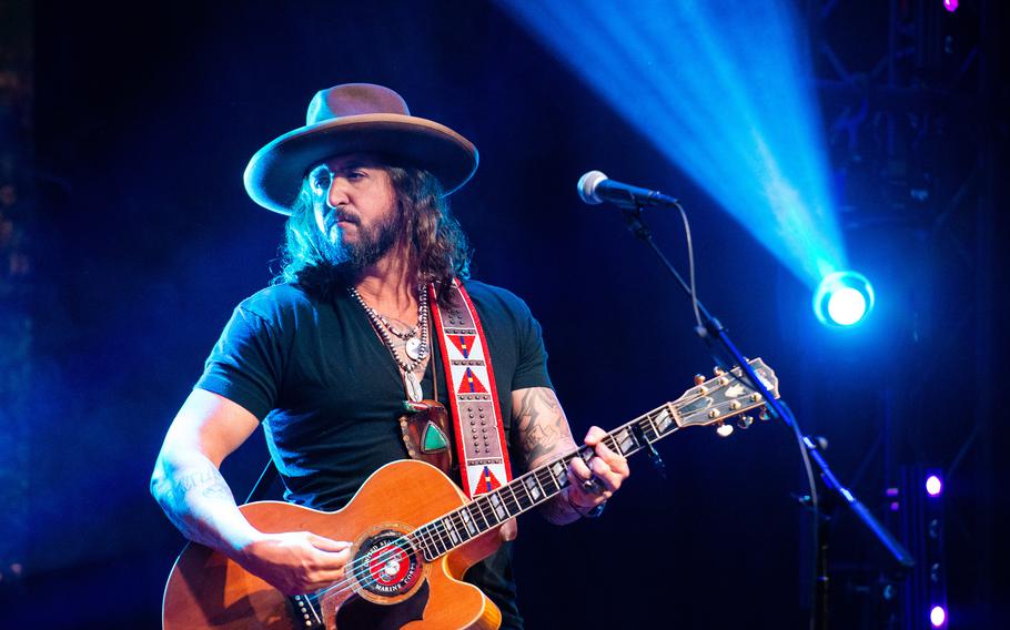 Scooter Brown, a Marine veteran who served in the 2003 invasion of Iraq, performs as half of the Nashville, Tenn.-based country duo War Hippies on March 9, 2023, during a concert at MadLife Stage & Studios in Woodstock, Ga., just north of Atlanta.